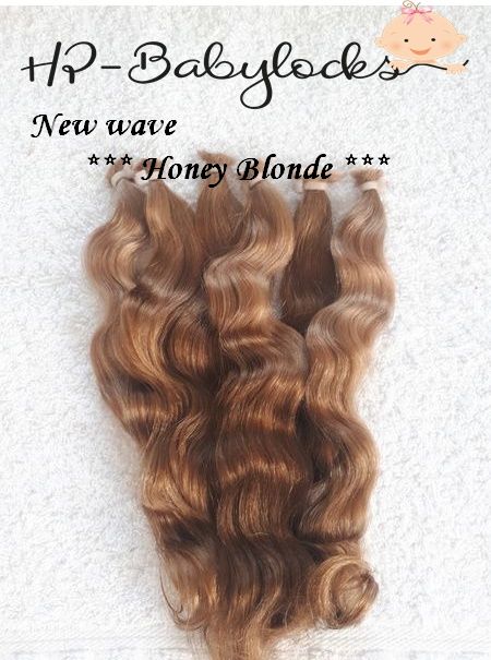 honey blonde reborn doll mohair hair on a light background