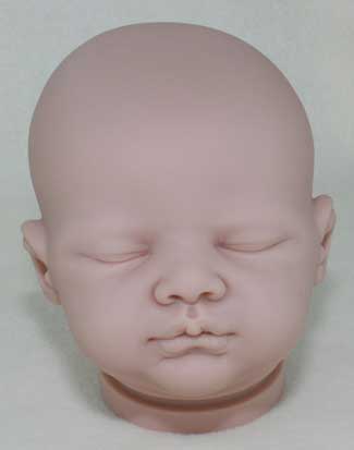 Realistic silicone baby head mold on a white background