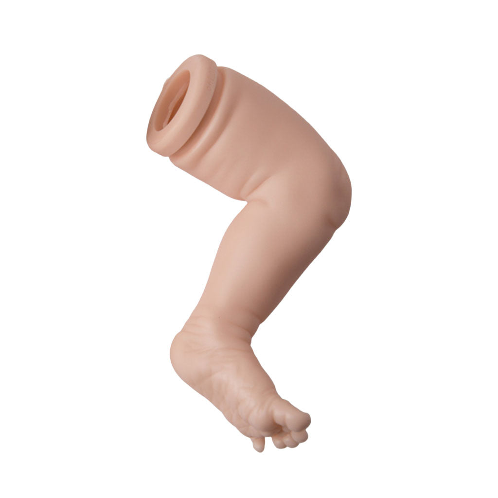 realistic vinyl baby doll leg on a white background